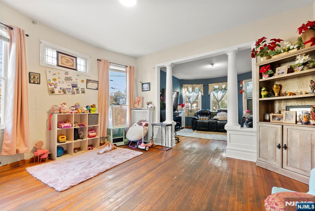 91 Headley Terrace Irvington, NJ 07111 - Photo 11 of 50 a living room with furniture and a wooden floor