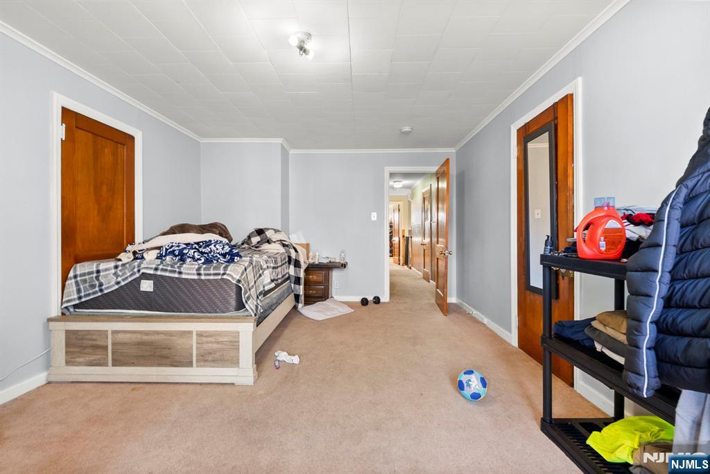 91 Headley Terrace Irvington, NJ 07111 - Photo 22 of 50 a bedroom with a bed and a window