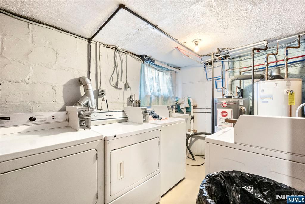 91 Headley Terrace Irvington, NJ 07111 - Photo 44 of 50 a kitchen with sink cabinets and appliances
