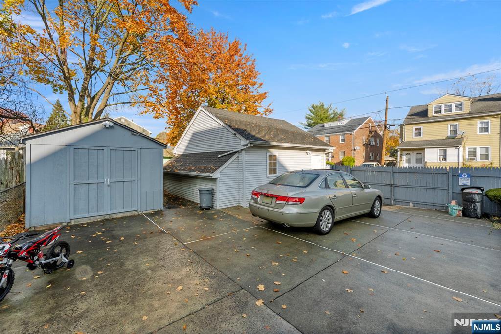 91 Headley Terrace Irvington, NJ 07111 - Photo 49 of 50 a car parked in front of a house