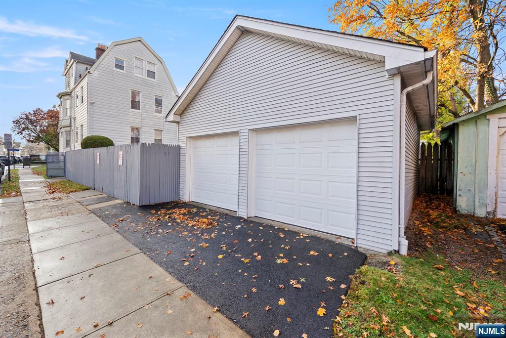 91 Headley Terrace Irvington, NJ 07111 - Photo 6 of 50 a front view of a house with a yard