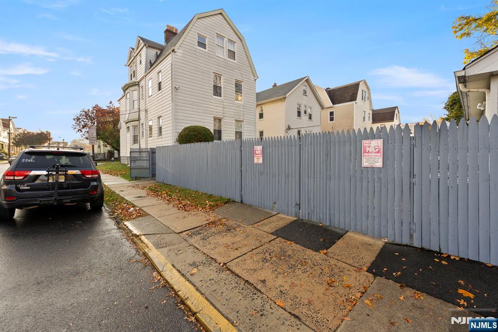 91 Headley Terrace Irvington, NJ 07111 - Photo 7 of 50 a view of a white car parked in front of a house