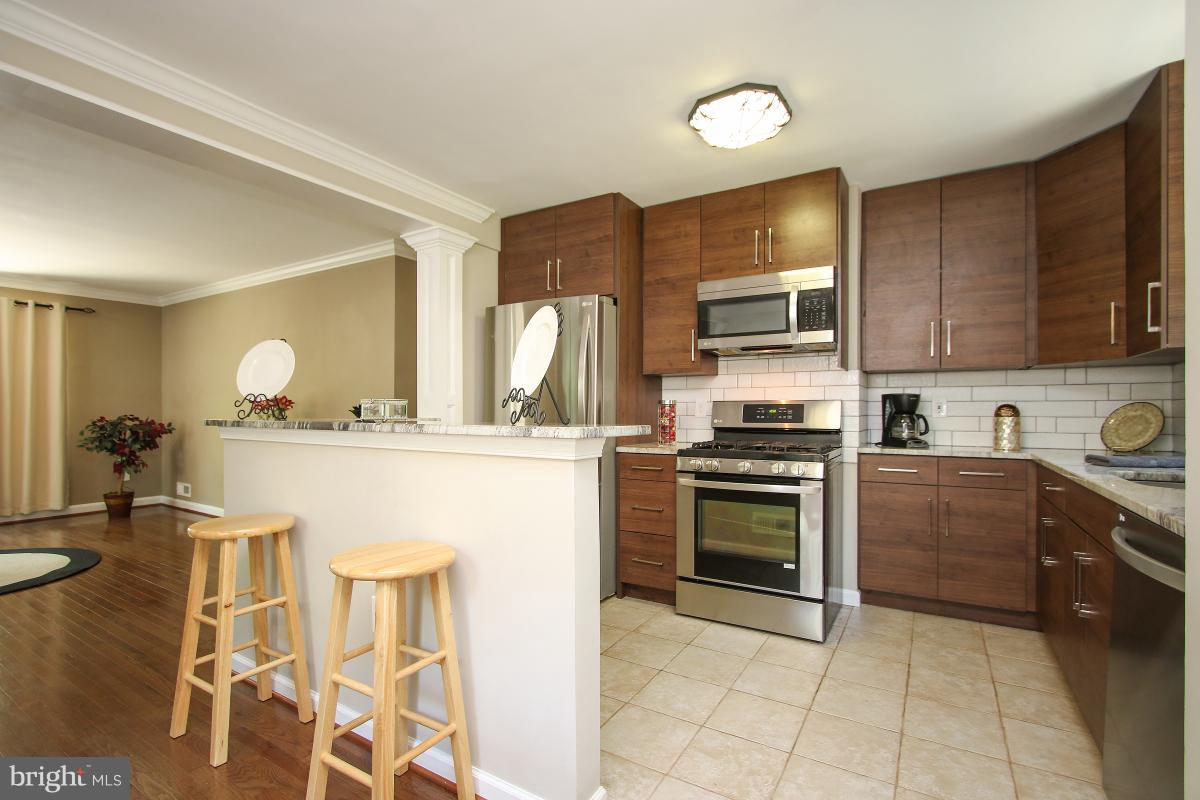 4043 Adams Drive Silver Spring, MD 20902 - Photo 9 of 30 Kitchen with breakfast bar