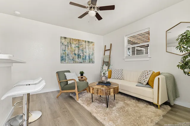 a living room with furniture and a window