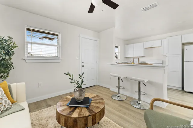 a kitchen with a table and chairs