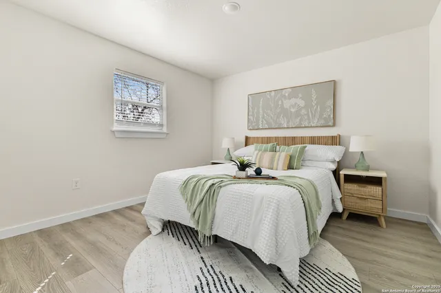 a bedroom with bed and a window