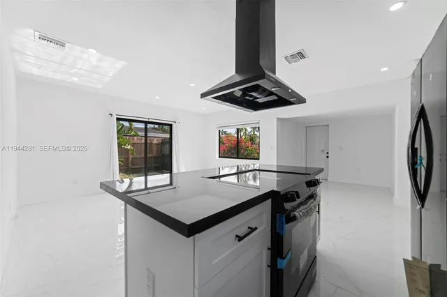 a view of an empty room with a balcony