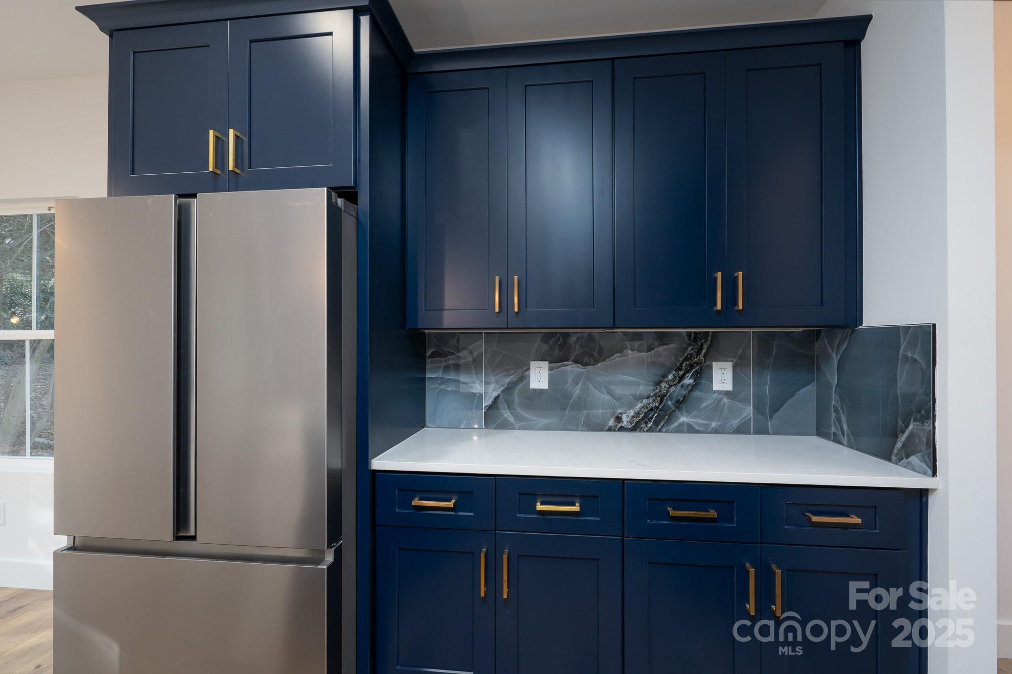 924 Oregon Street Kannapolis, NC 28083 - Photo 27 of 34 a kitchen with metallic refrigerator freezer and a dishwasher