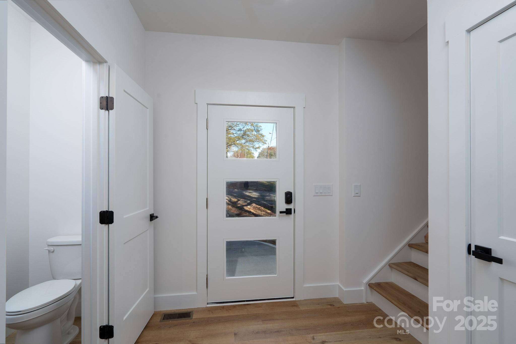 924 Oregon Street Kannapolis, NC 28083 - Photo 28 of 34 a hallway with a door and a rug