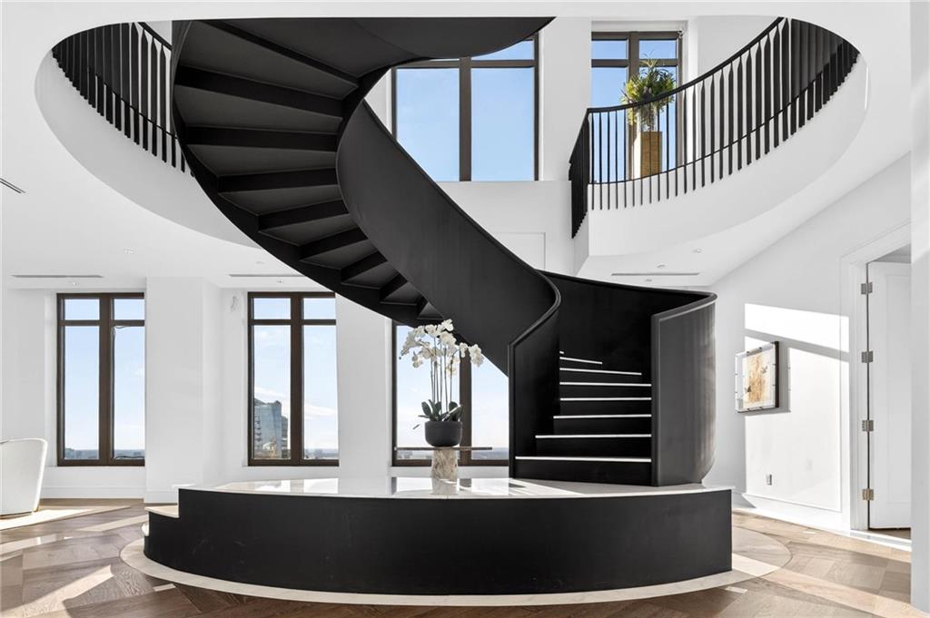 3376 Peachtree Road Northeast, Unit 57 & 58 Atlanta, GA 30326 - Photo 3 of 48 a view of entryway and hall with wooden floor