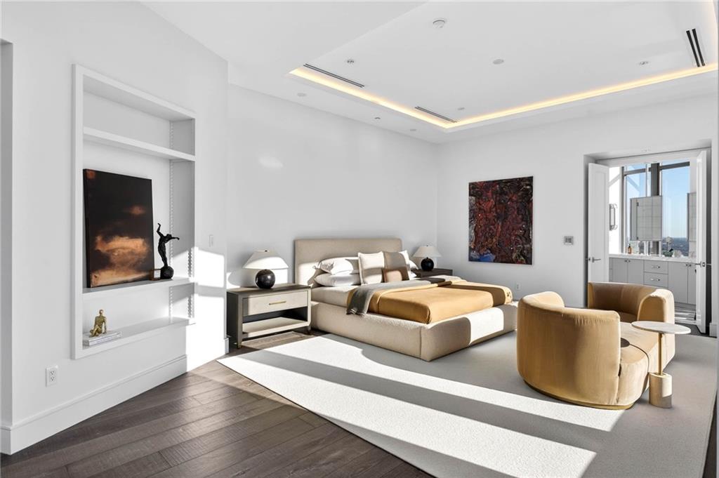 3376 Peachtree Road Northeast, Unit 57 & 58 Atlanta, GA 30326 - Photo 34 of 48 a living room with furniture and a flat screen tv