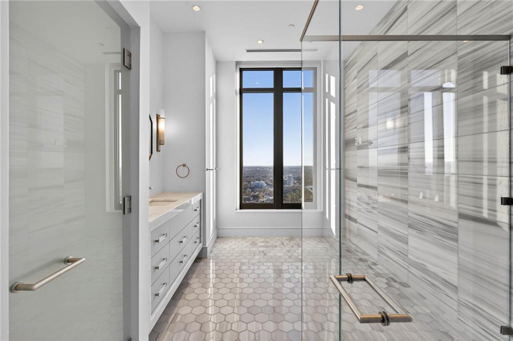 3376 Peachtree Road Northeast, Unit 57 & 58 Atlanta, GA 30326 - Photo 45 of 48 a bathroom with a shower and a sink