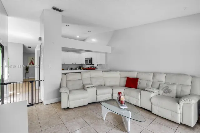 a living room with furniture and a couch