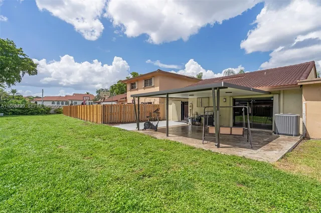 a view of a house with a yard porch and sitting area