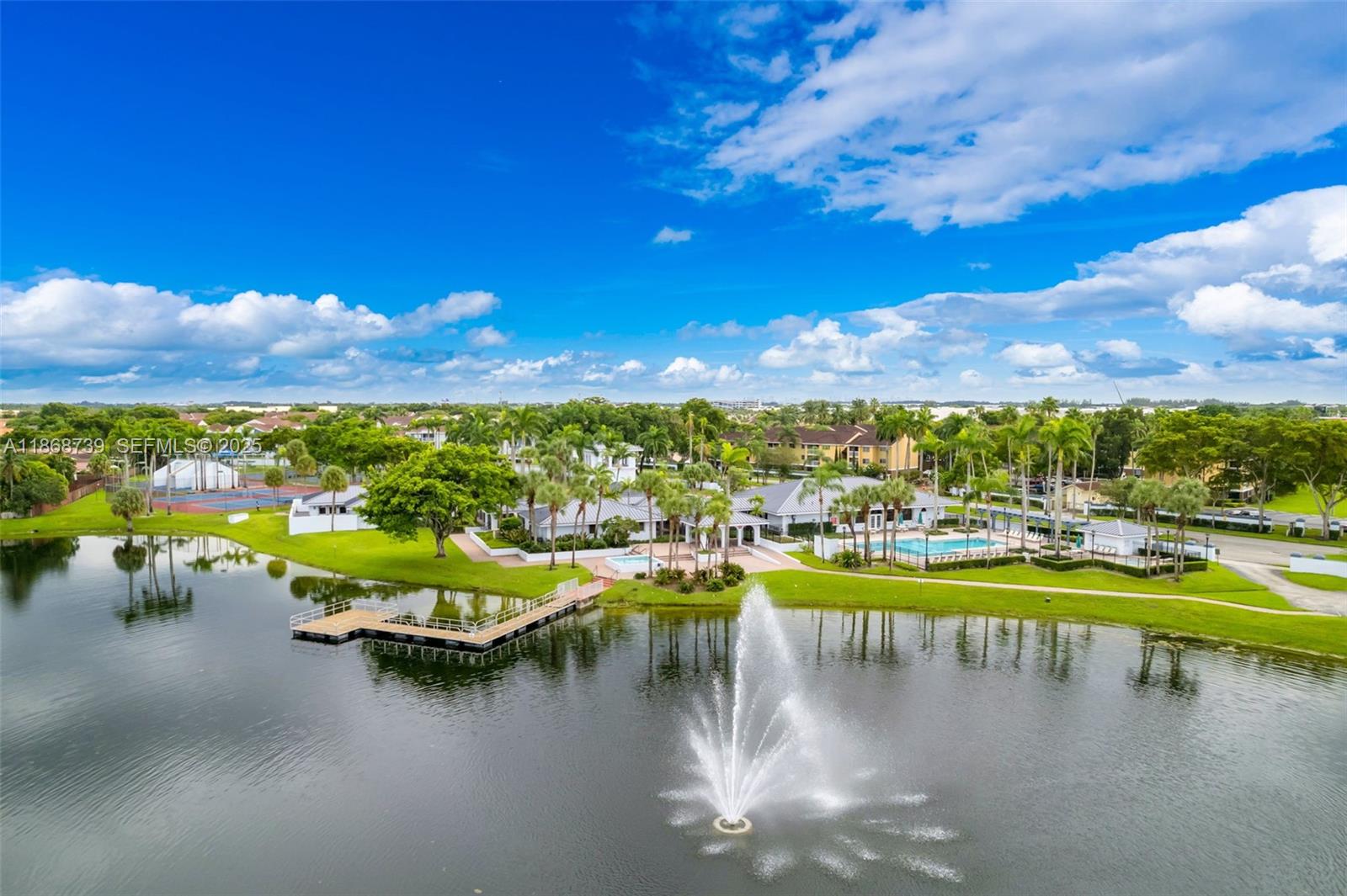 6646 Northwest 175th Terrace Hialeah, FL 33015 - Photo 28 of 33 a view of a lake with boats in the back