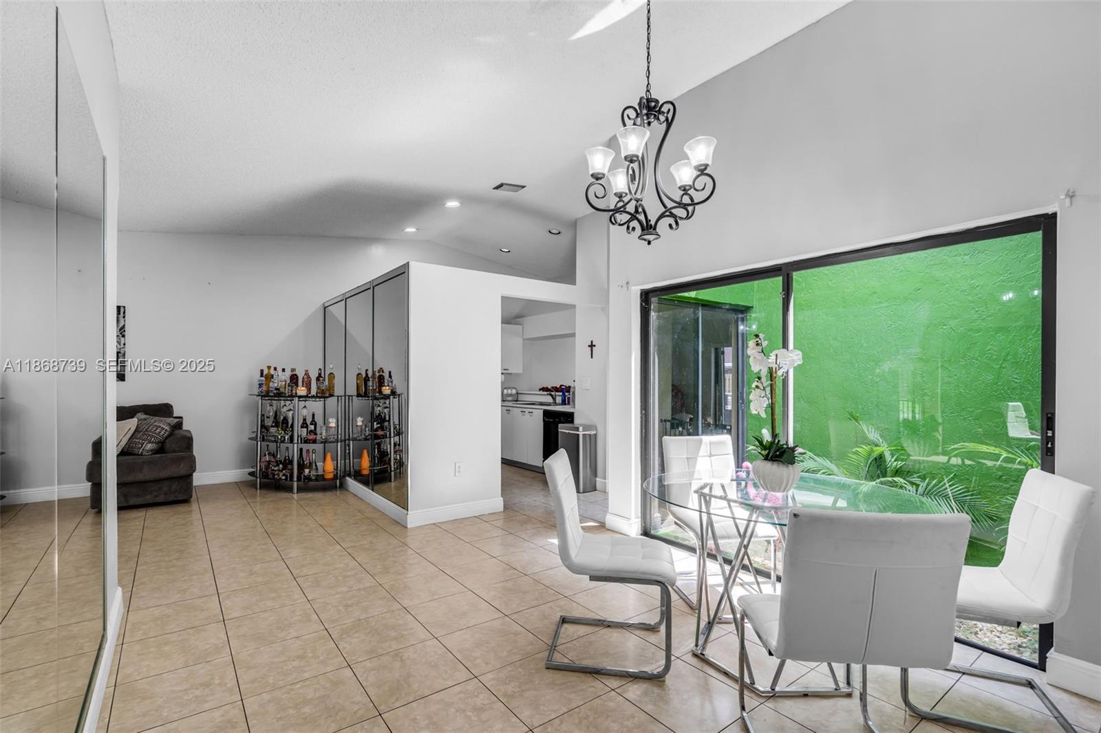 6646 Northwest 175th Terrace Hialeah, FL 33015 - Photo 7 of 33 a view of a dining room with furniture window and outside view