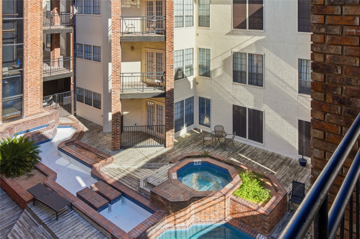 3001 Cedar Street, Unit 116 Austin, TX 78705 - Photo 3 of 14 a view of a house with pool and sitting area