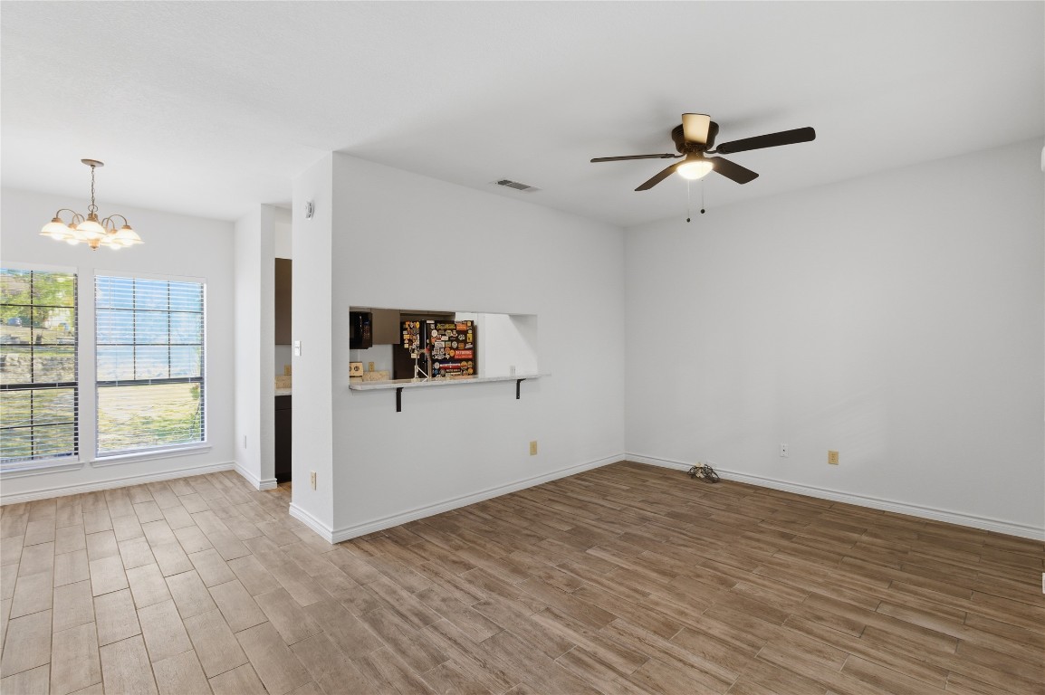 3001 Cedar Street, Unit 116 Austin, TX 78705 - Photo 4 of 14 wooden floor in an empty room with a window