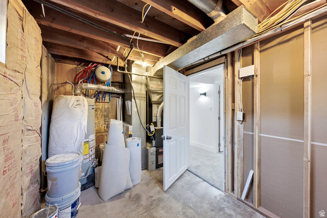 120 North 1230 E Street Springville, UT 84663 - Photo 34 of 60 Unfinished basement area featuring exposed ceiling joists, concrete flooring, and a white interior door leading to a finished space