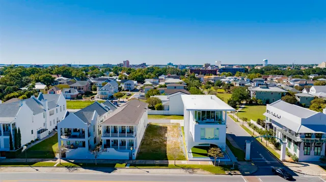 a view of multiple houses with yard