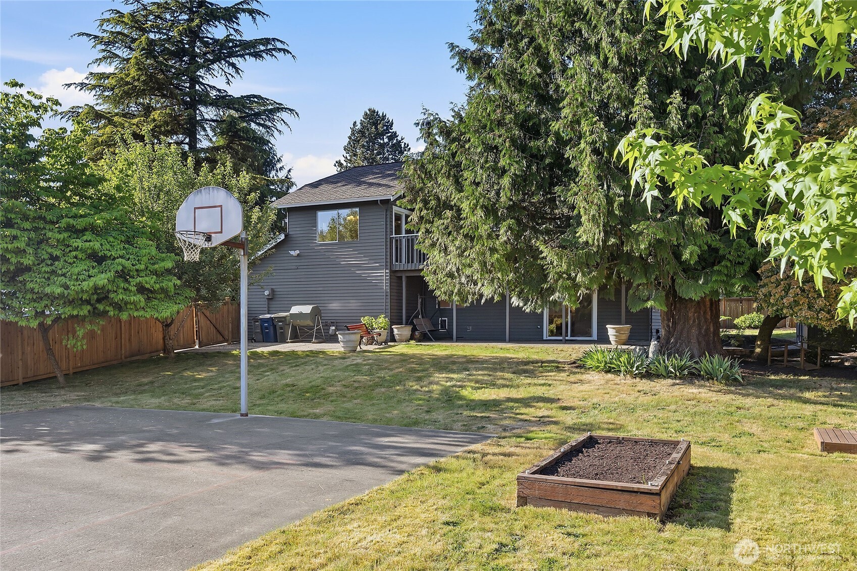 23707 Meridian Place West Bothell, WA 98021 - Photo 33 of 40 a front view of a house with a yard garage and outdoor seating