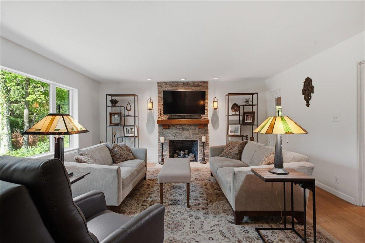 63 Ski Hill Road Portage, IN 46368 - Photo 2 of 28 a living room with fireplace furniture and a flat screen tv