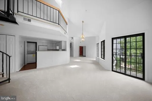 a view of a hallway with staircase