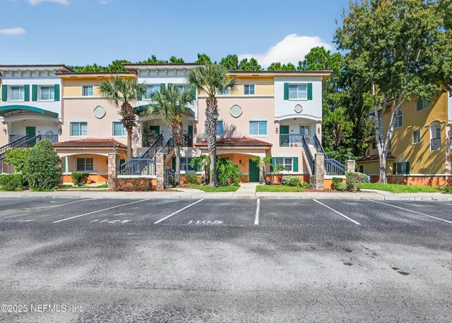 a view of multiple houses with a street
