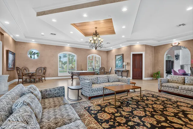 a large kitchen with stainless steel appliances a sink and cabinets