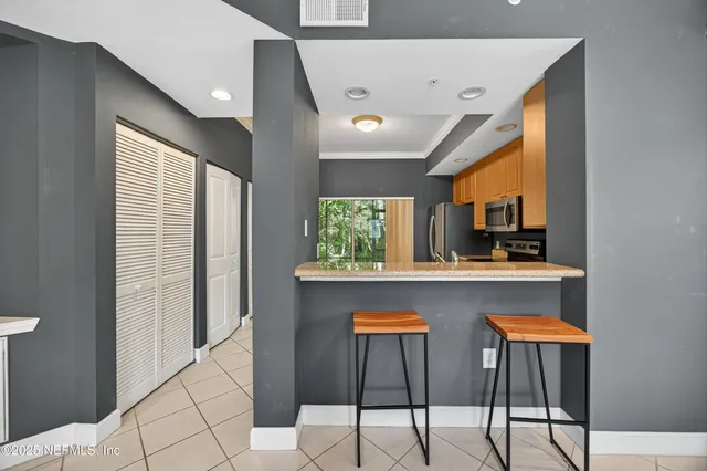 a kitchen with a sink cabinets and window