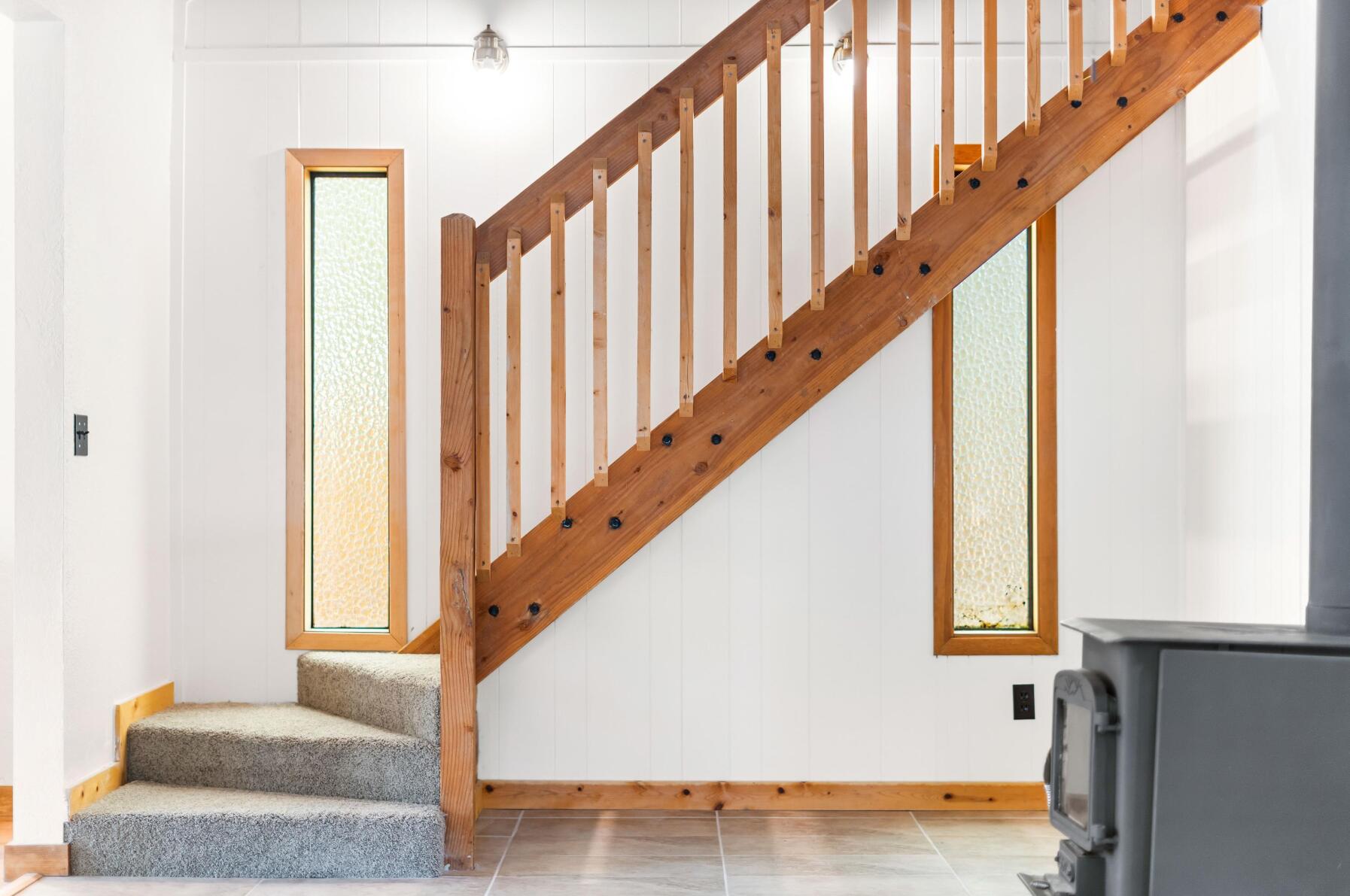 56244 Black Duck Road Bend, OR 97707 - Photo 11 of 24 a view of staircase with railing and white walls