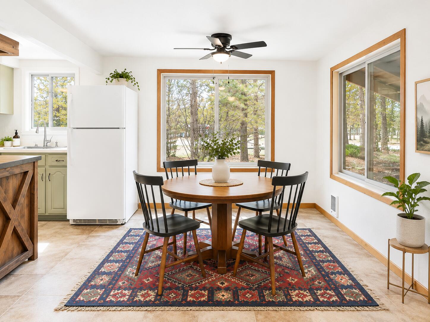 56244 Black Duck Road Bend, OR 97707 - Photo 7 of 24 a view of a dining room with furniture window and wooden floor