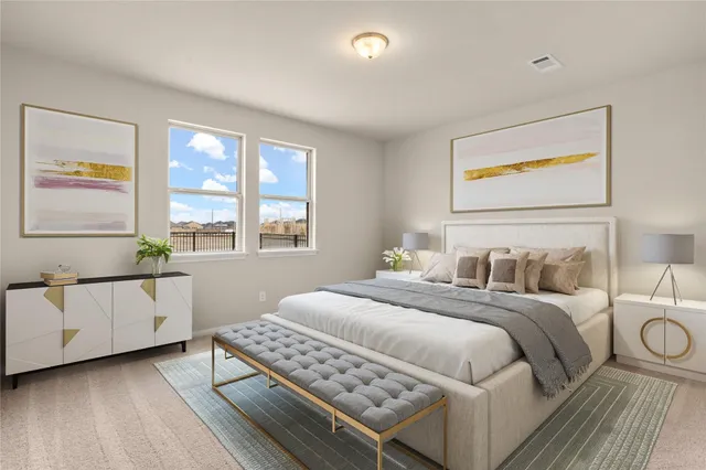 a bedroom with a bed and window