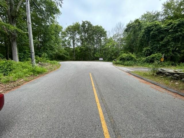 455 Hazelnut Hill Road Groton, CT 06340 - Photo 1 of 1 a view of a road with trees in the background