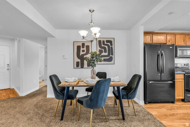 1136 West Spencer Road, Unit Y203 Pleasant Grove, UT 84062 - Photo 12 of 26 Dining room with hanging lights and light wood-style floors