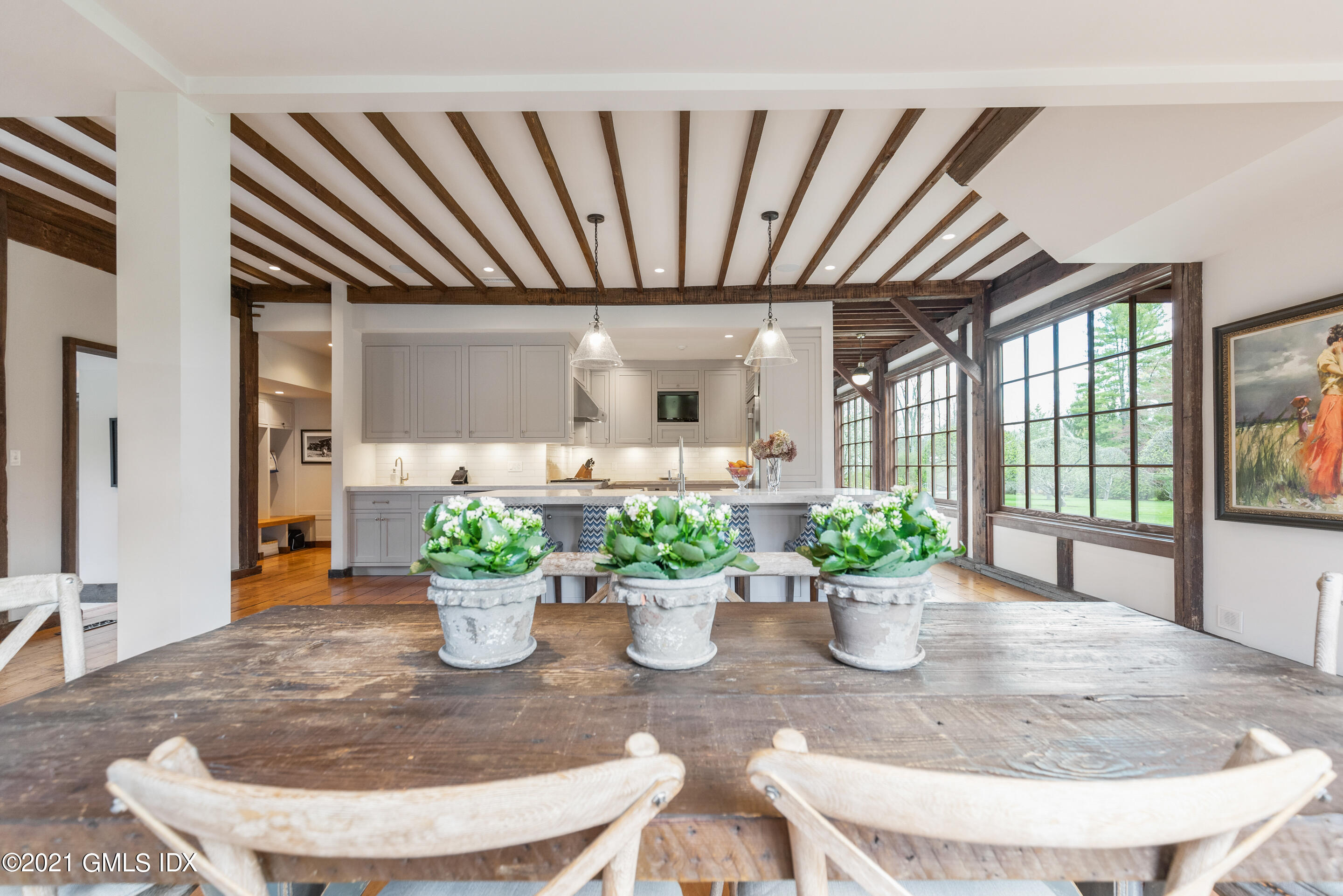 46 Dewart Road Greenwich, CT 06830 - Photo 12 of 39 a view of a dining room with furniture window and wooden floor