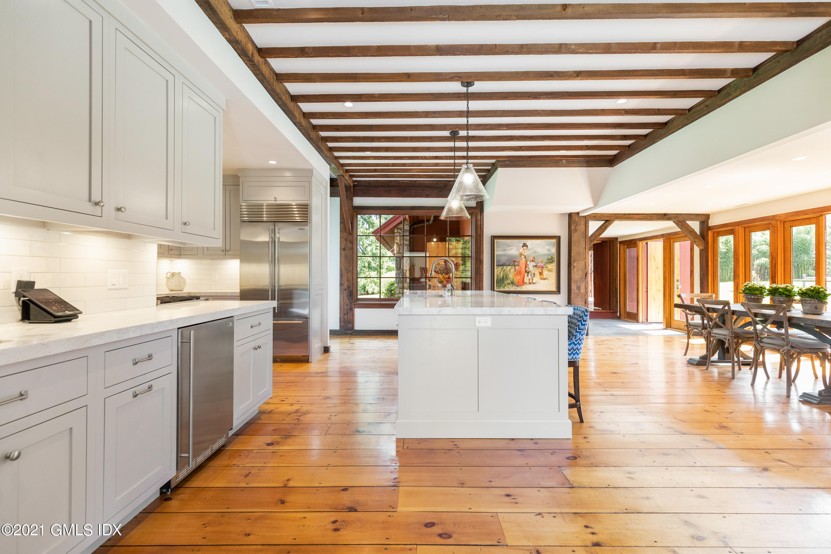 46 Dewart Road Greenwich, CT 06830 - Photo 15 of 39 a hallway with white cabinets and wooden floor