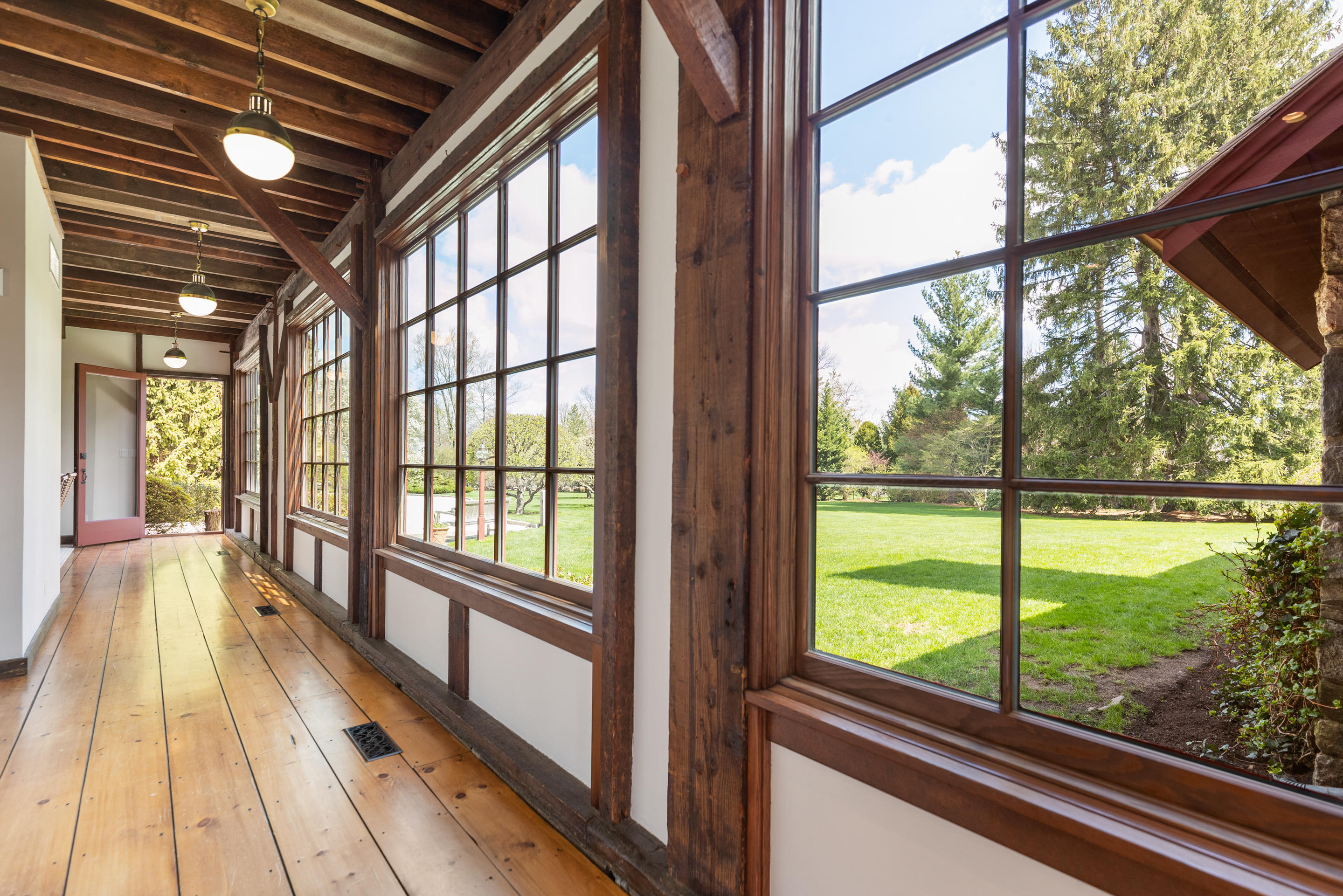 46 Dewart Road Greenwich, CT 06830 - Photo 19 of 39 a view of big room with wooden floor and windows