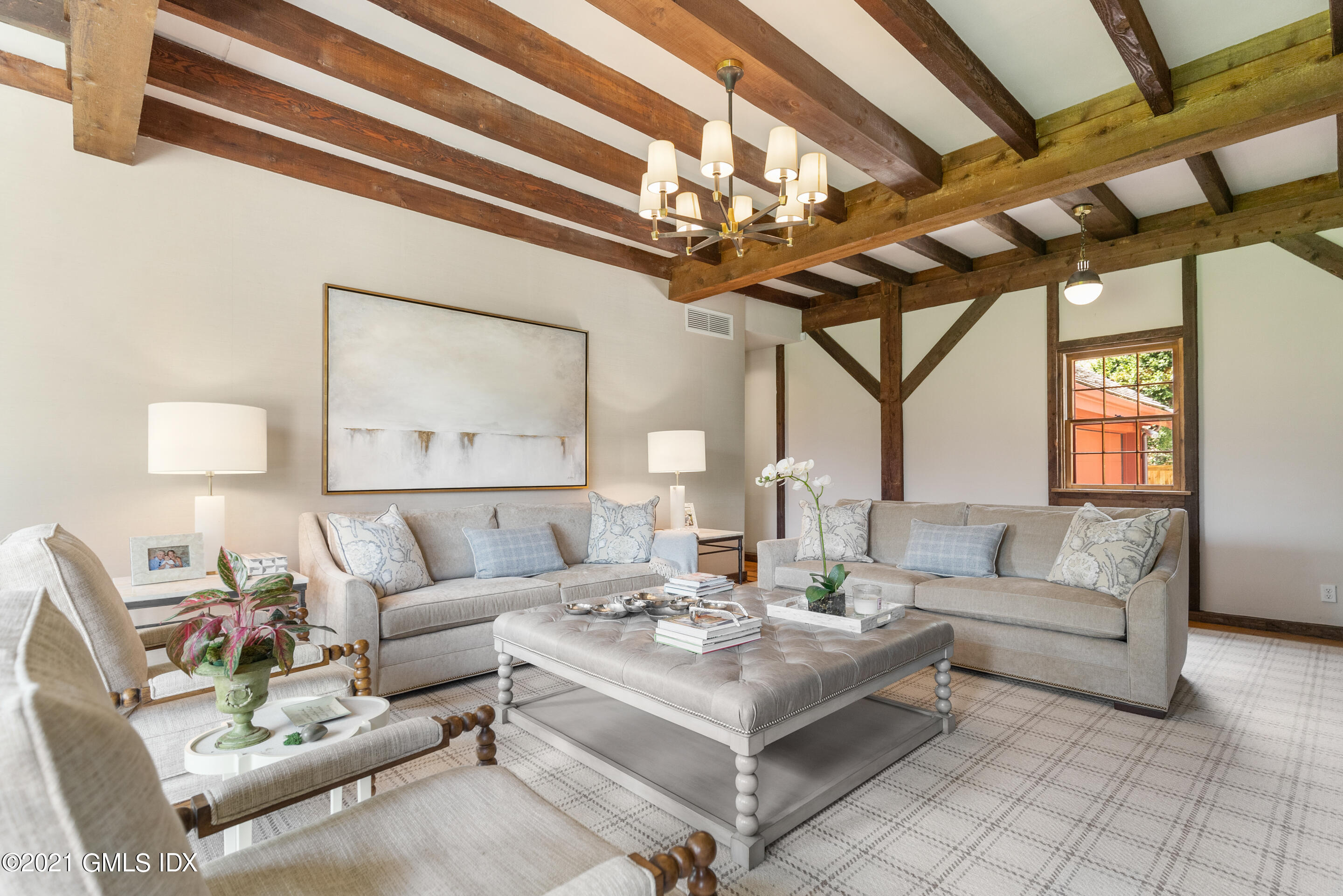 46 Dewart Road Greenwich, CT 06830 - Photo 20 of 39 a living room with furniture a chandelier and a chandelier