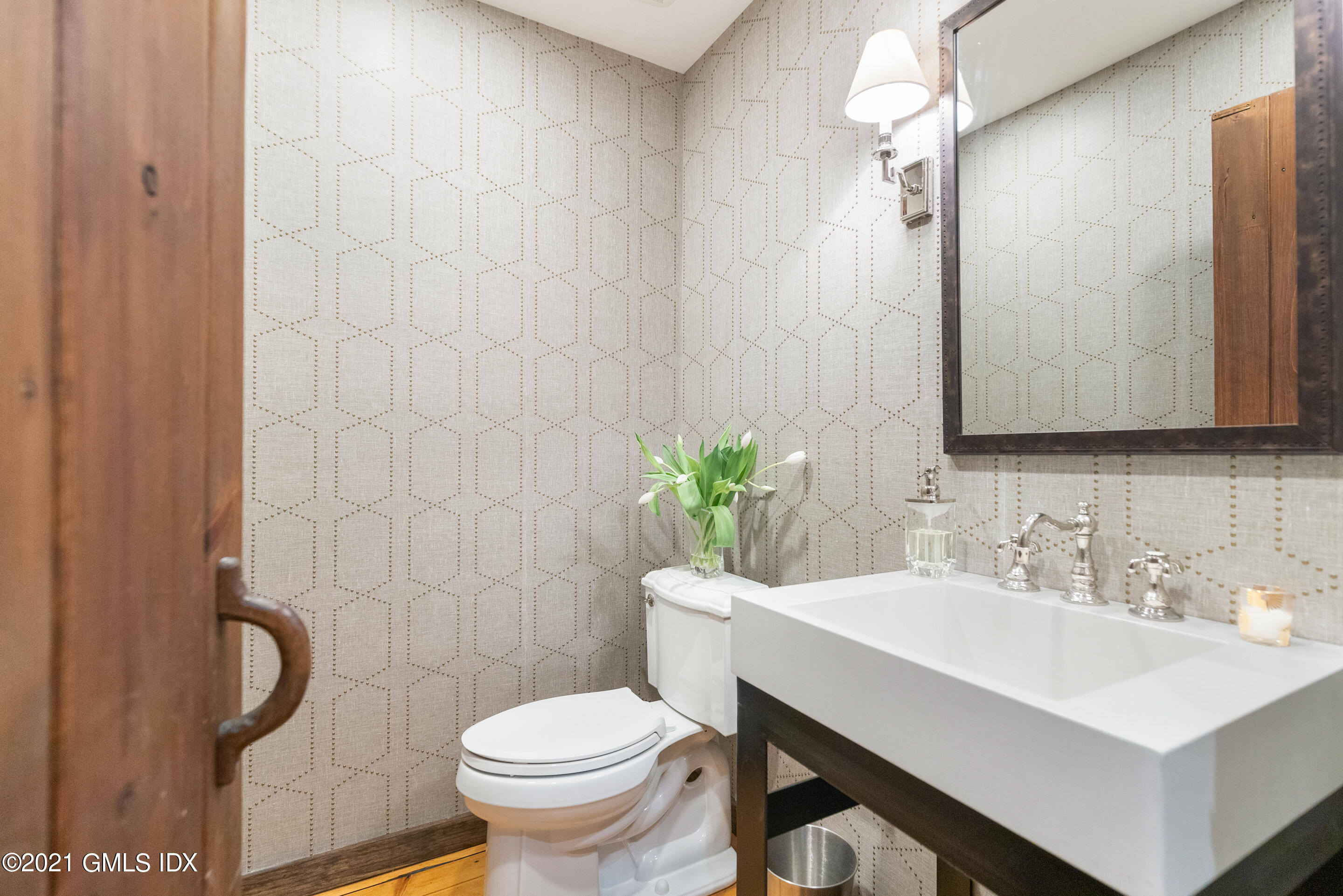 46 Dewart Road Greenwich, CT 06830 - Photo 24 of 39 a bathroom with a sink toilet and a mirror