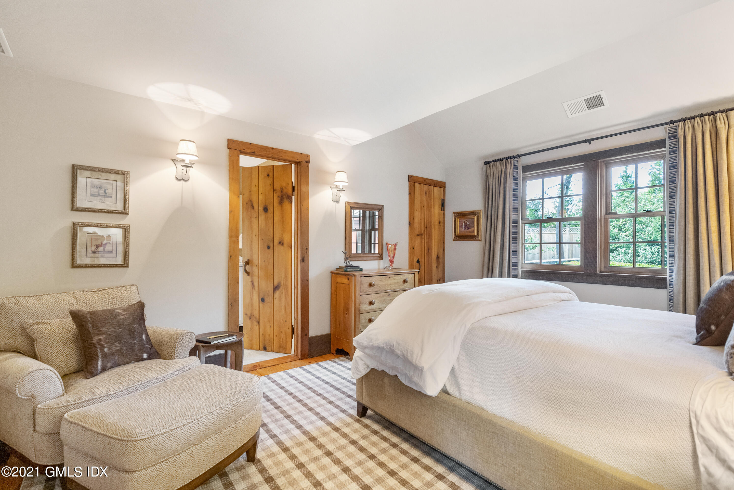 46 Dewart Road Greenwich, CT 06830 - Photo 26 of 39 a spacious bedroom with a bed and wooden floor