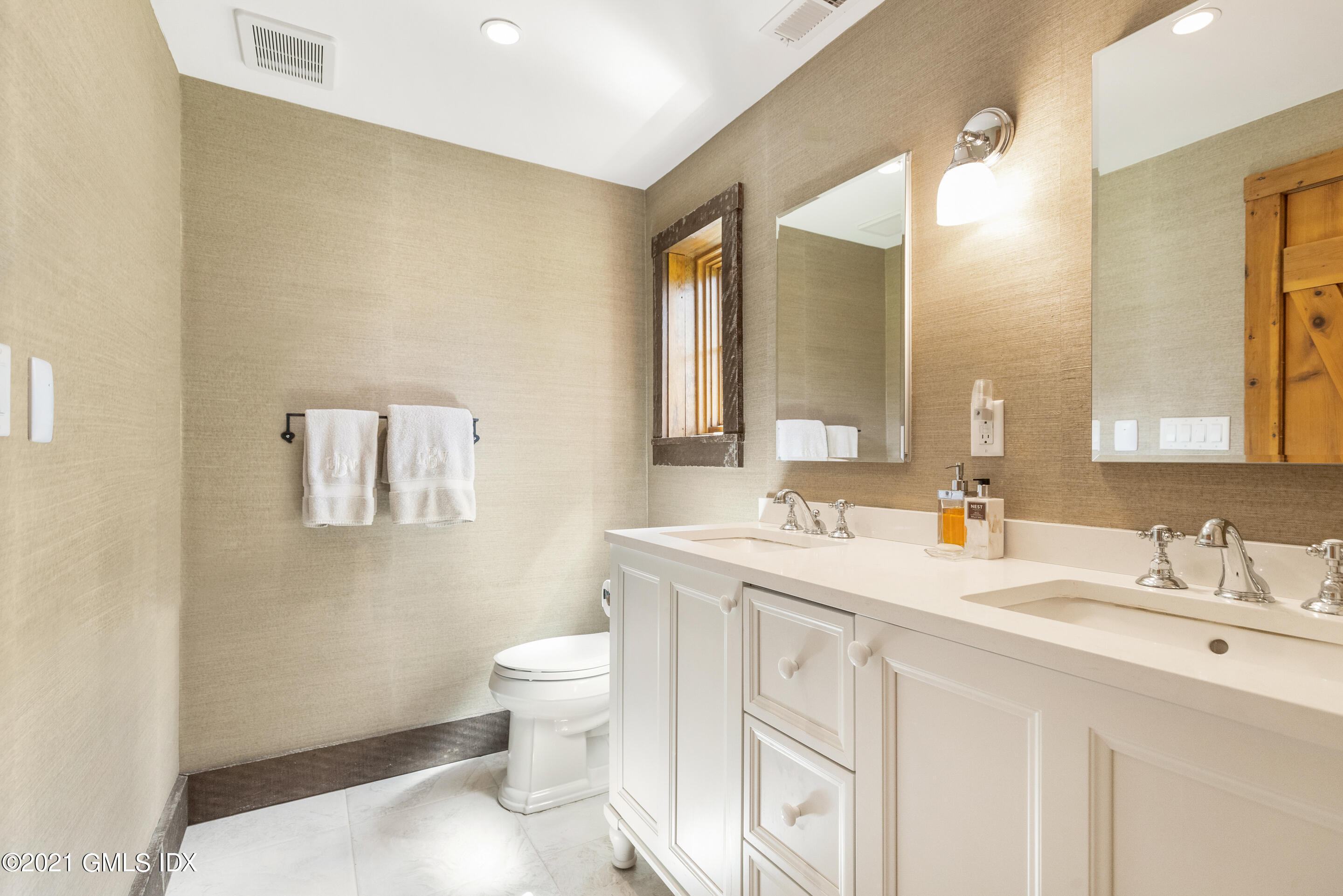 46 Dewart Road Greenwich, CT 06830 - Photo 27 of 39 a bathroom with a toilet sink and mirror