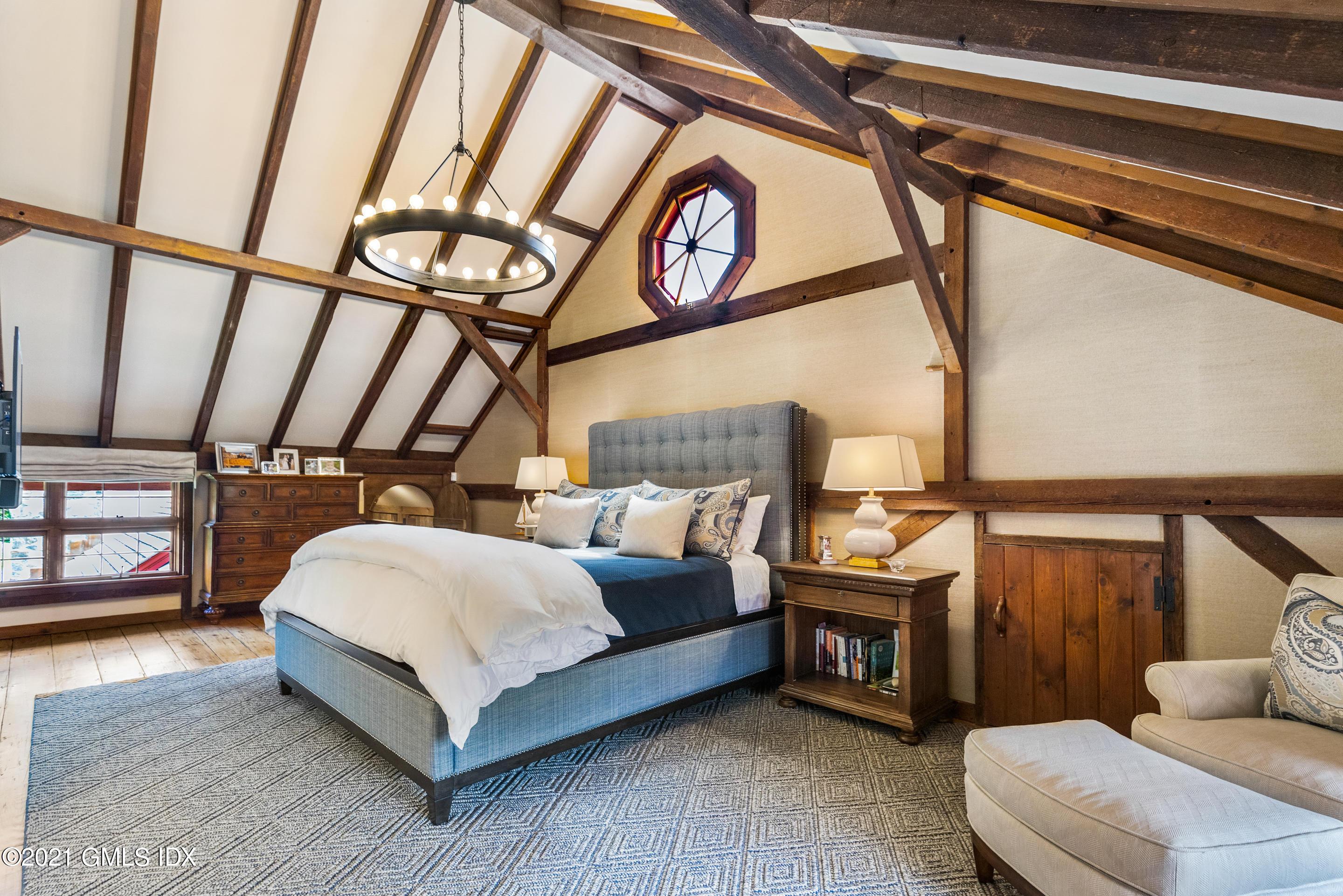 46 Dewart Road Greenwich, CT 06830 - Photo 28 of 39 a spacious bedroom with a bed a couch and dresser