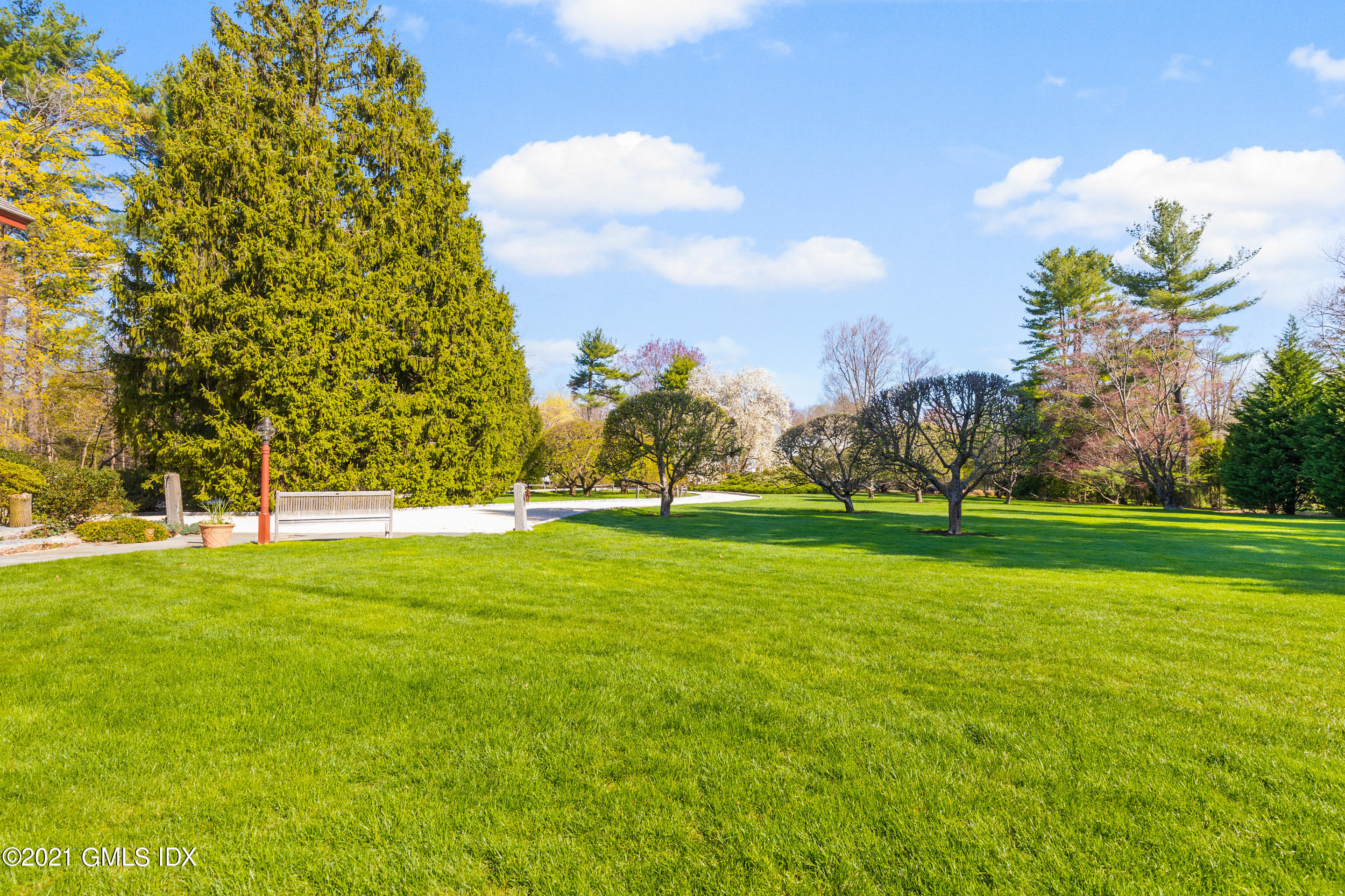 46 Dewart Road Greenwich, CT 06830 - Photo 37 of 39 a view of a field of grass and trees
