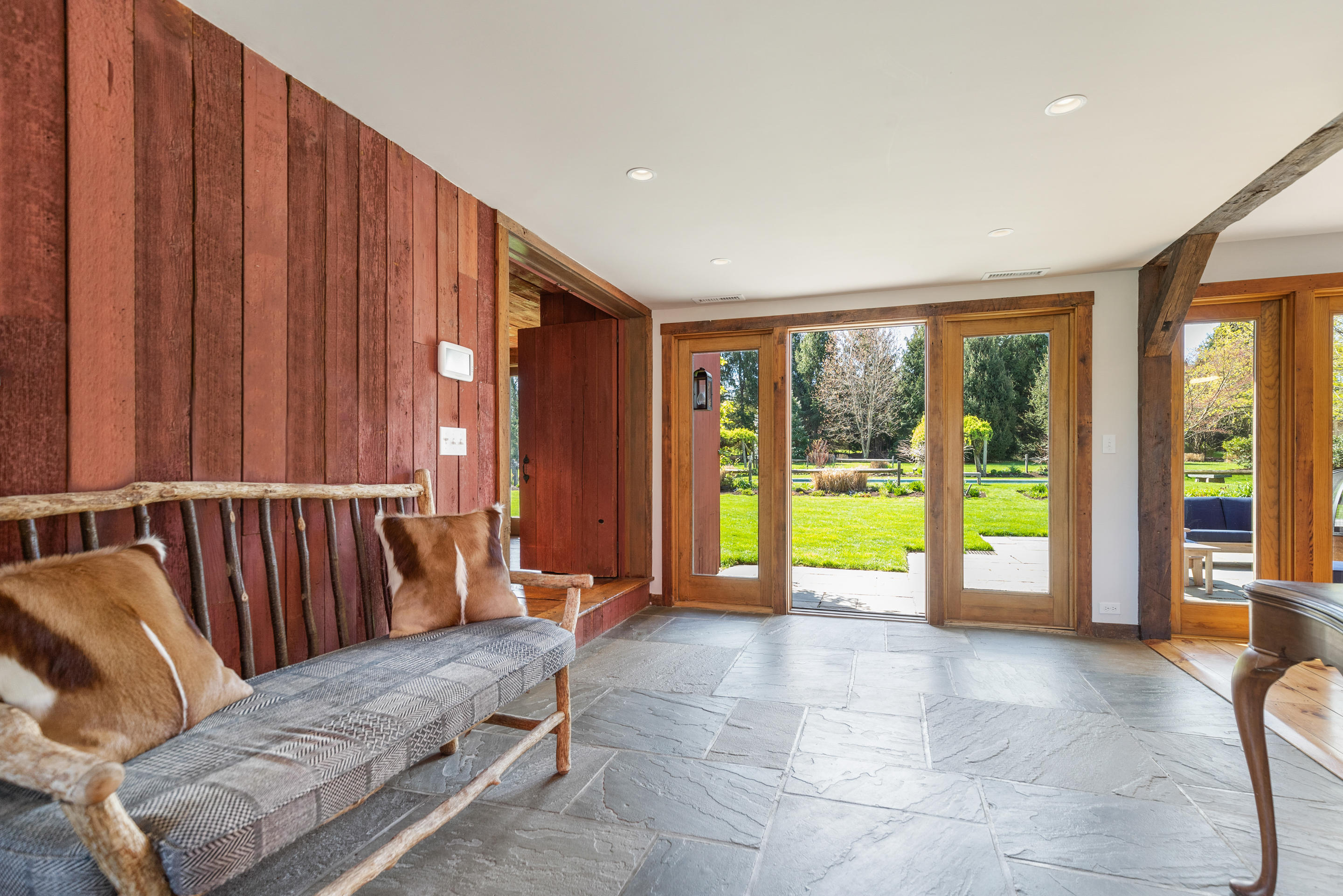 46 Dewart Road Greenwich, CT 06830 - Photo 6 of 39 a living room with furniture and large windows