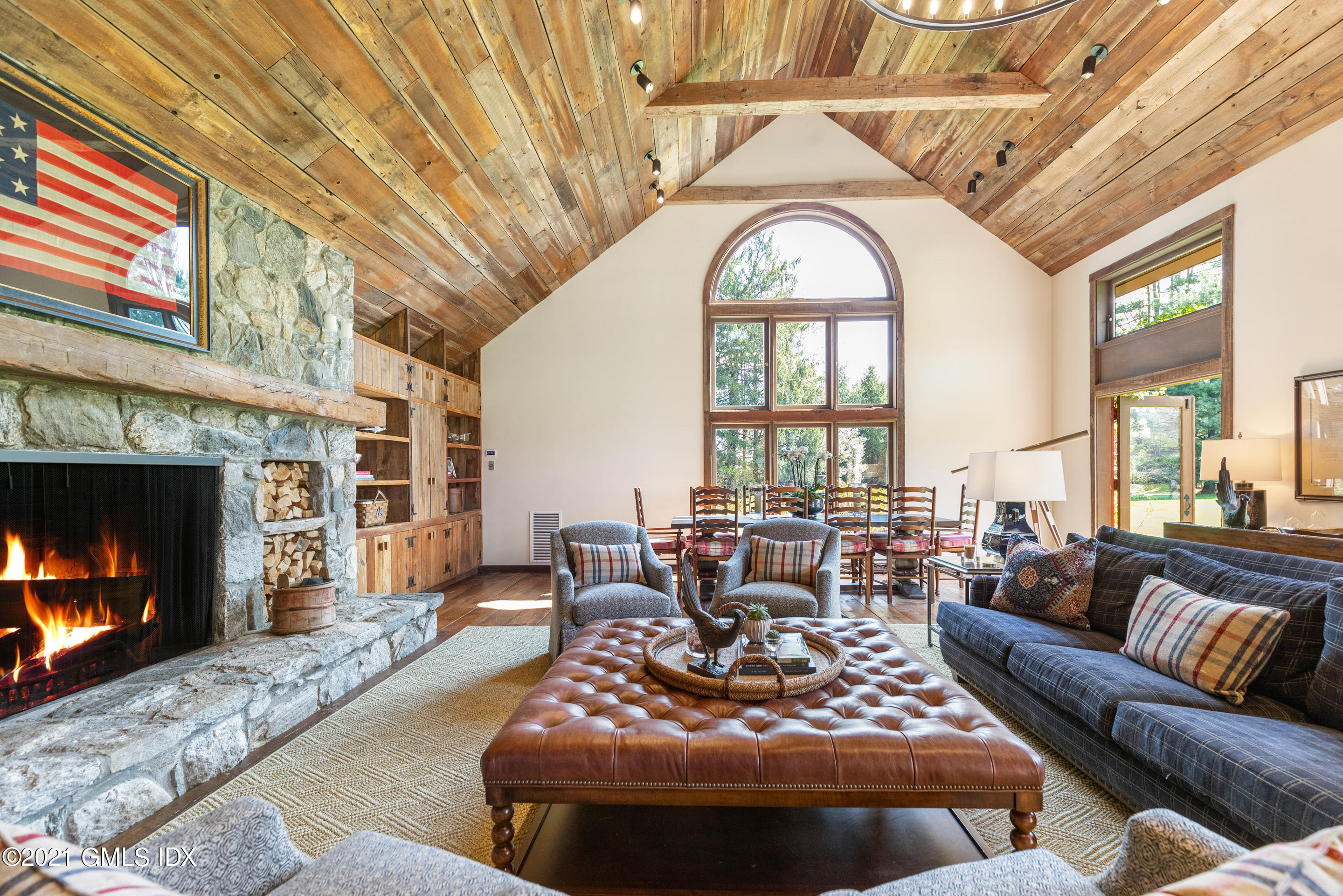 46 Dewart Road Greenwich, CT 06830 - Photo 7 of 39 a living room with furniture a fireplace and a dining table