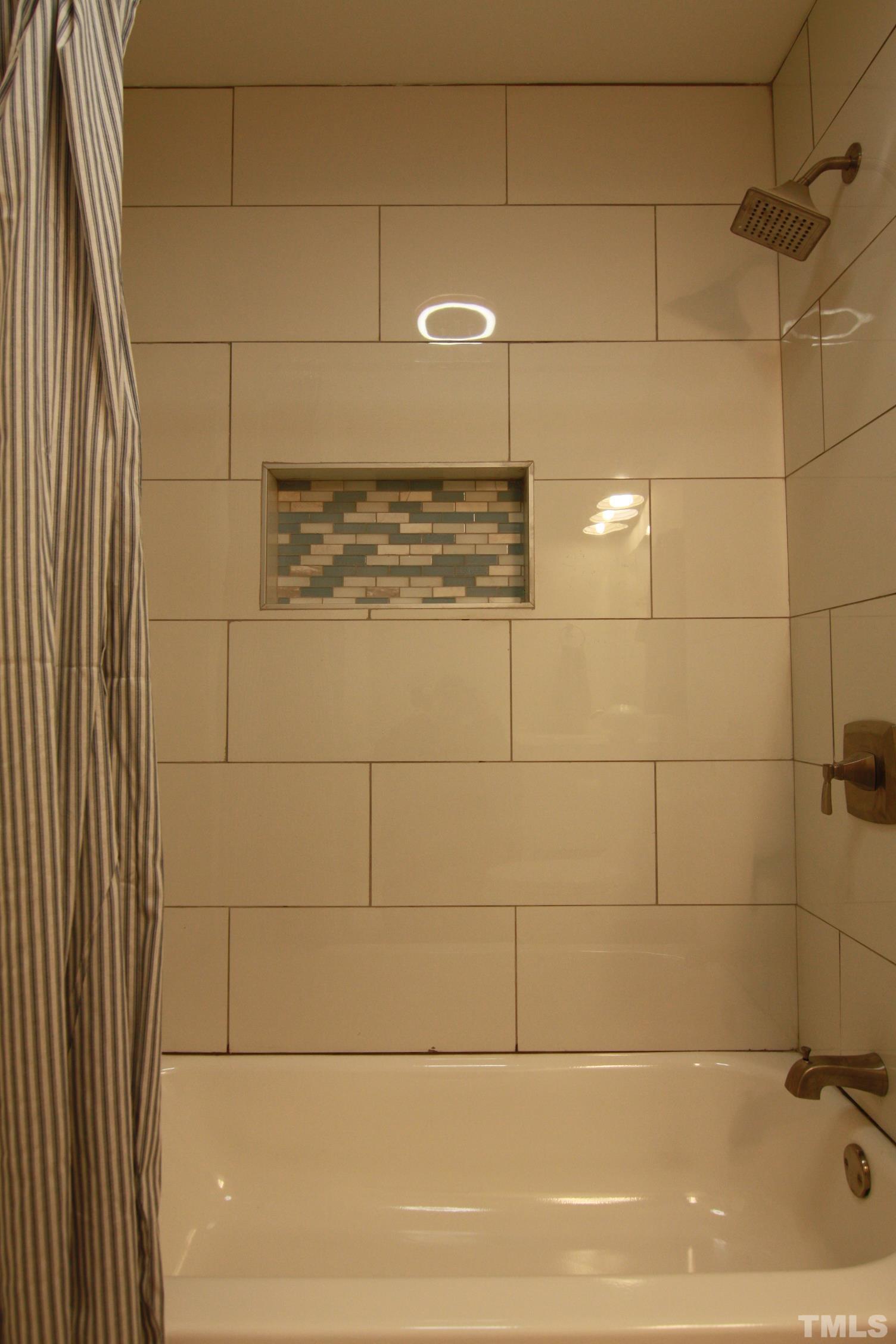 1503 Sedwick Road Durham, NC 27713 - Photo 21 of 33 a bathroom with a shower