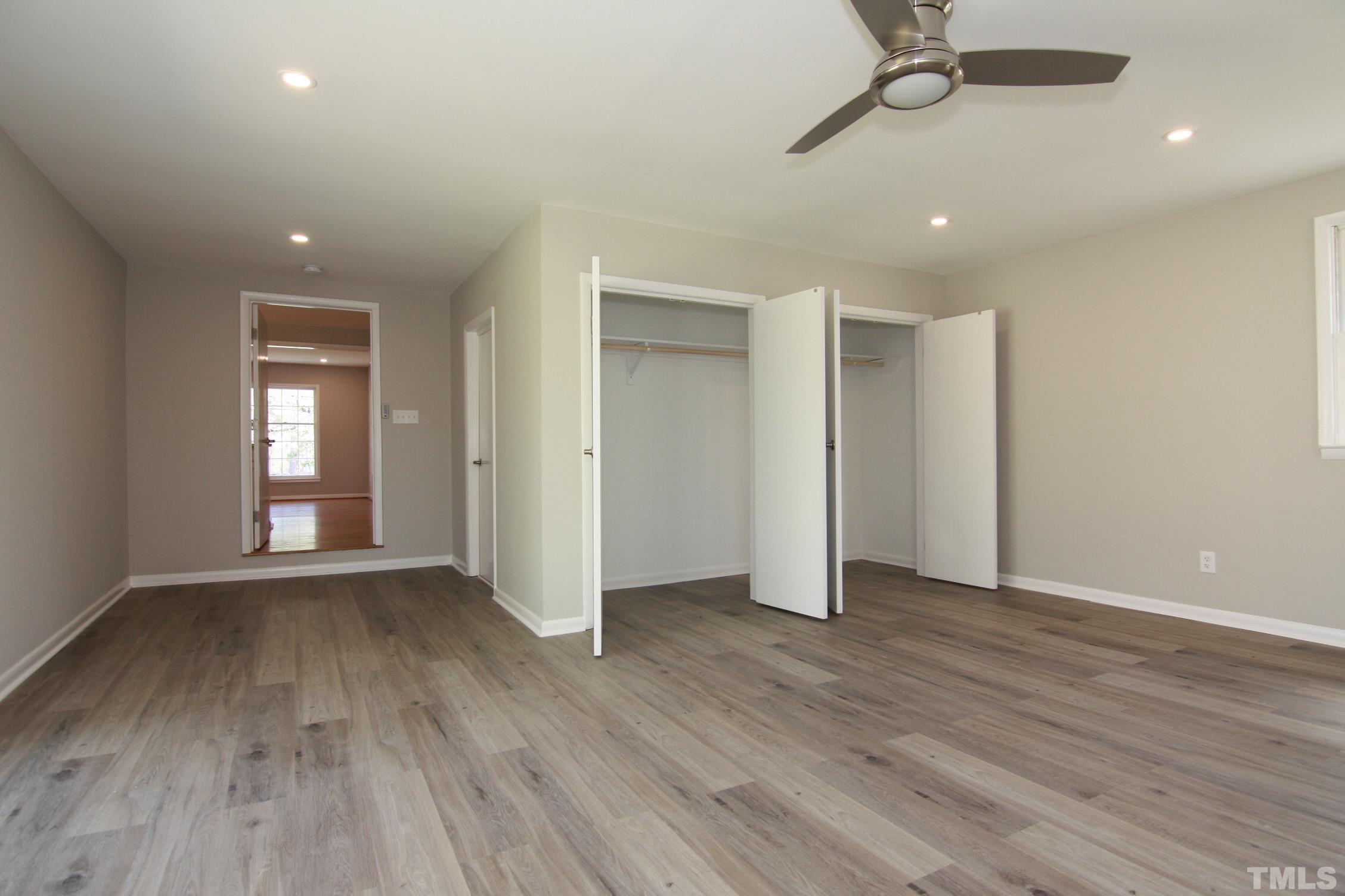 1503 Sedwick Road Durham, NC 27713 - Photo 27 of 33 wooden floor in an empty room with a window