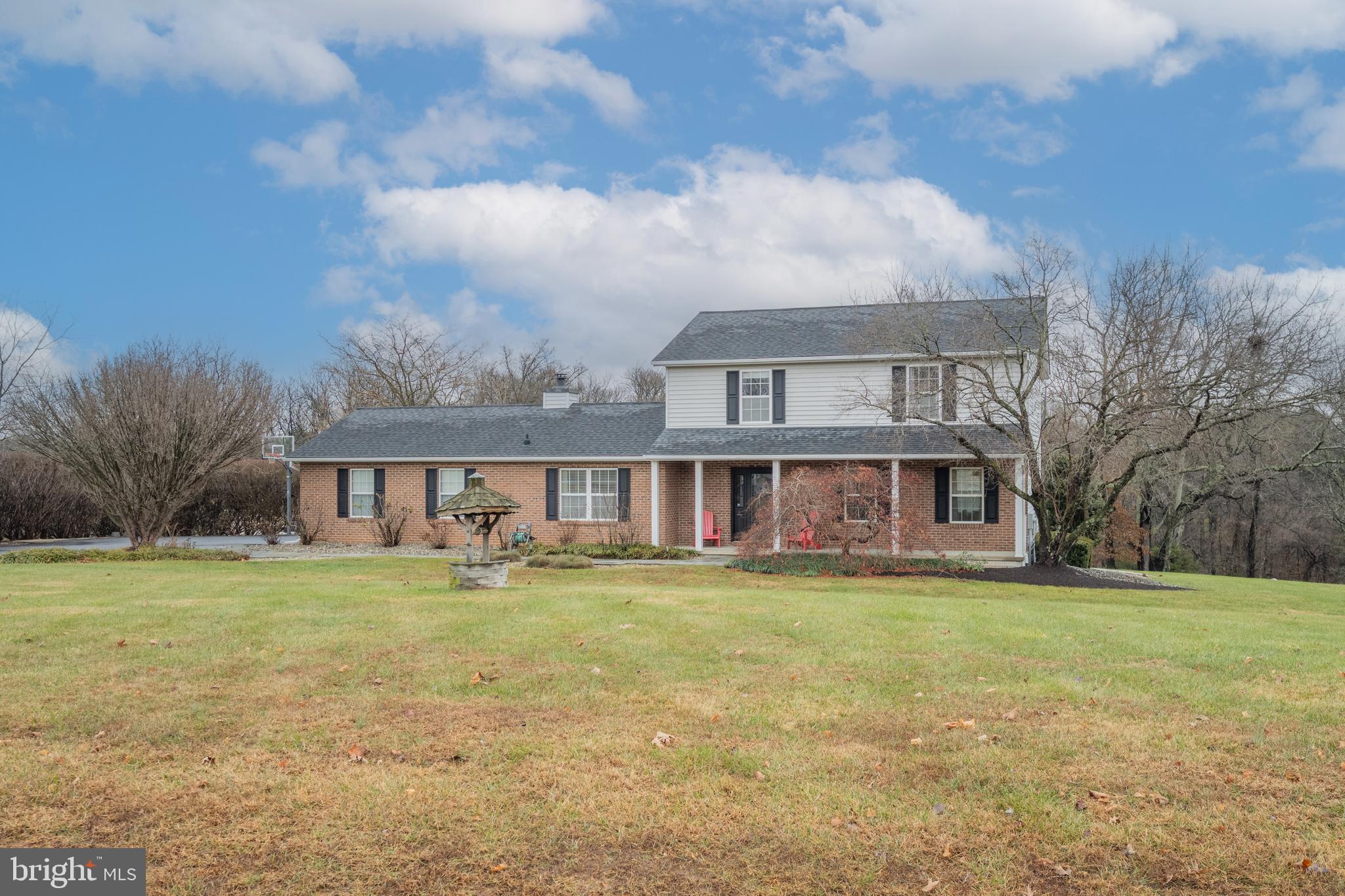 3211 Hayloft Court Woodbine, MD 21797 - Photo 1 of 69 a view of a house with a big yard and large trees