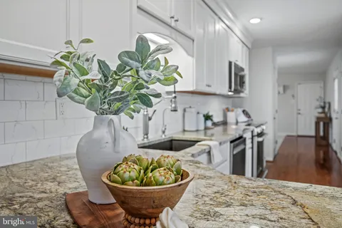 a kitchen with granite countertop a sink and a granite counter tops